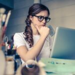 girl thinking on computer
