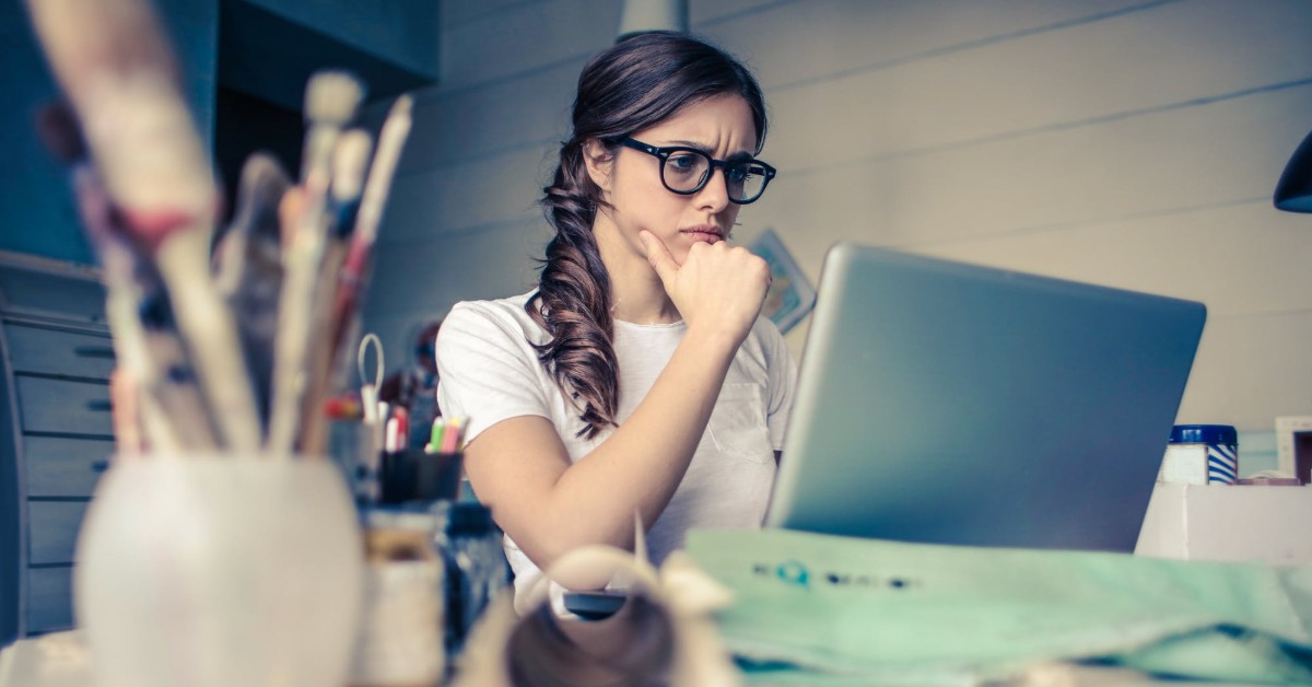 girl thinking on computer