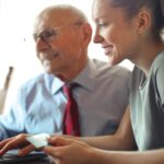 man and woman on computer