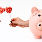 valetines day lollipops and a piggy bank