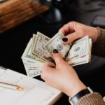 person counting their money