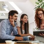 people at a table talking about a loan