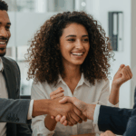 Two men exchange a handshake in a boardroom | MaxLend Loans
