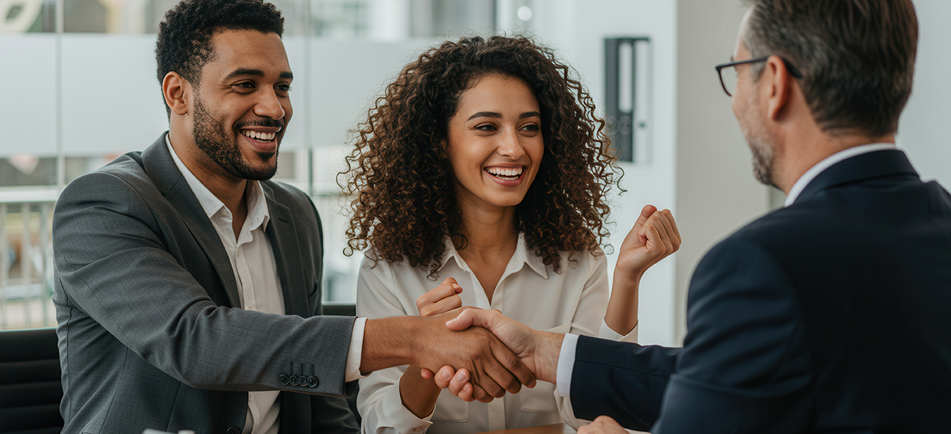 Two men exchange a handshake in a boardroom | MaxLend Loans